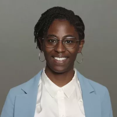 Woman headshot green background formal