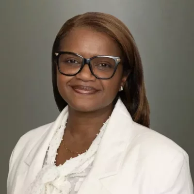 Woman headshot green background formal