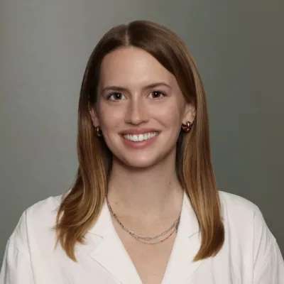Woman headshot green background formal