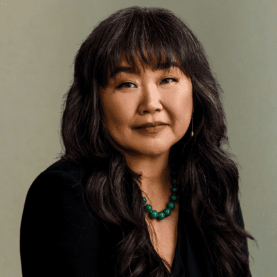 Woman formal headshot green background