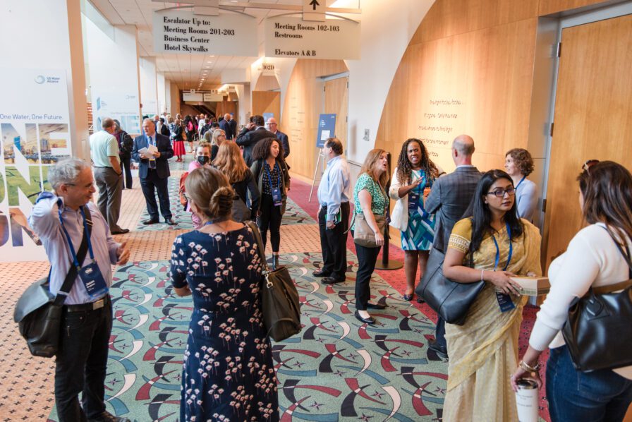 People talking in conference hall between sessions