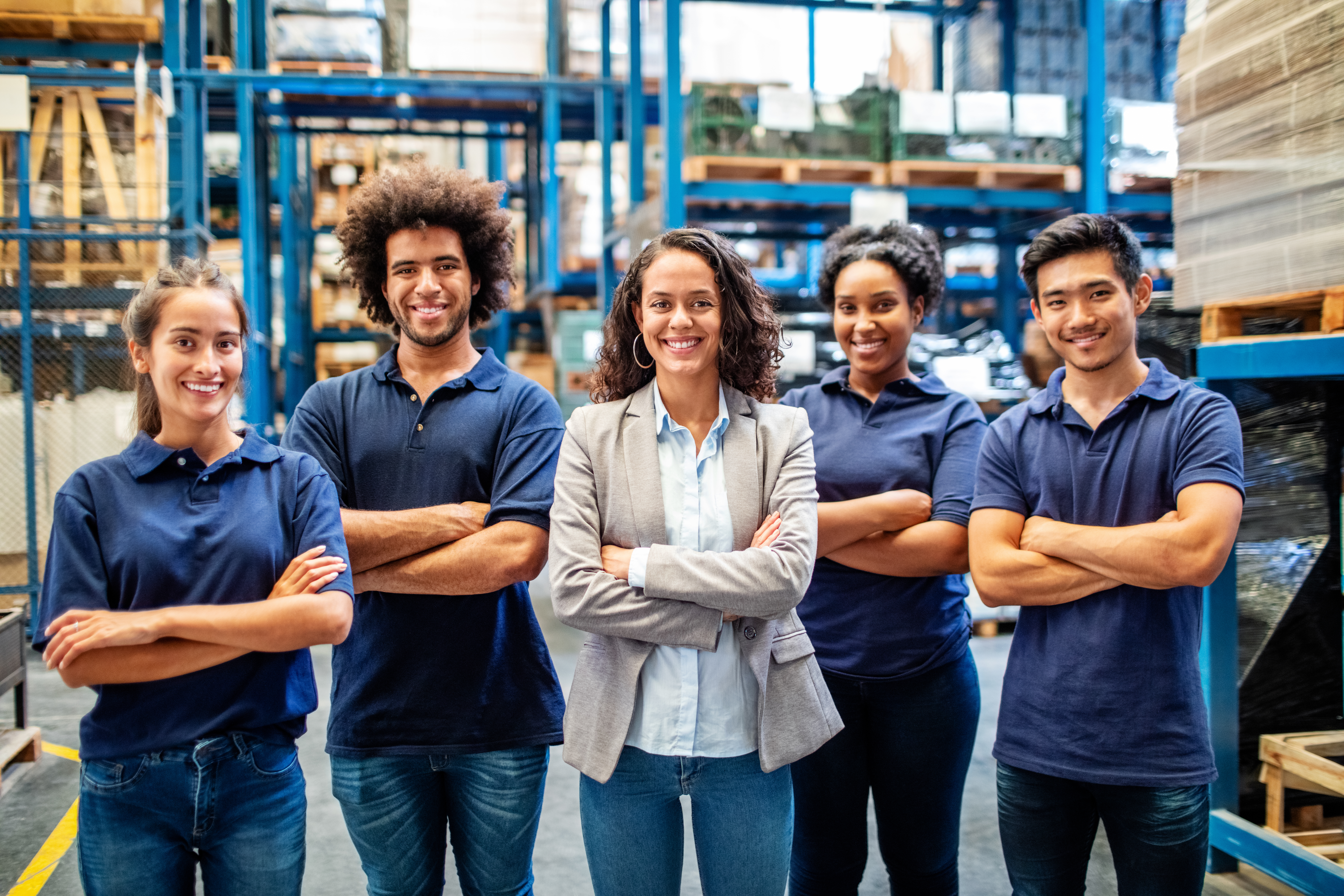 Portrait of manager with warehouse workers