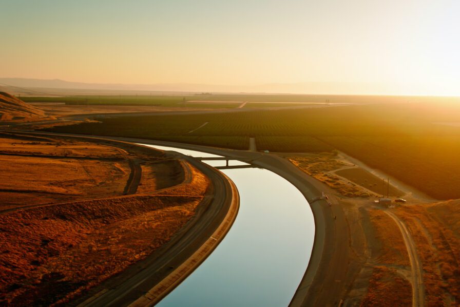 Rural canal sunset farmland