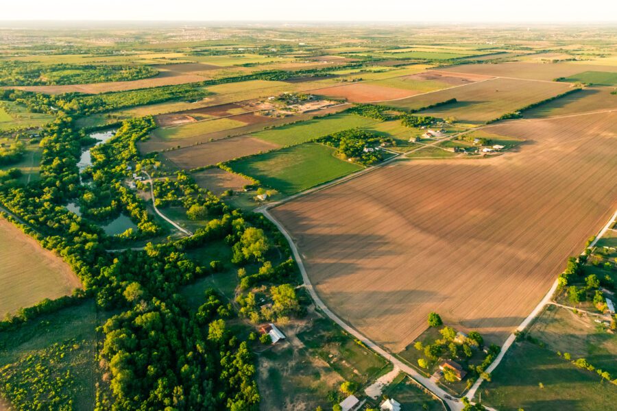 Rural farmland aerial view at sunset