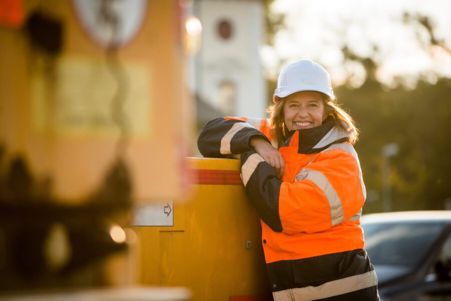 Female engineer smiling outside