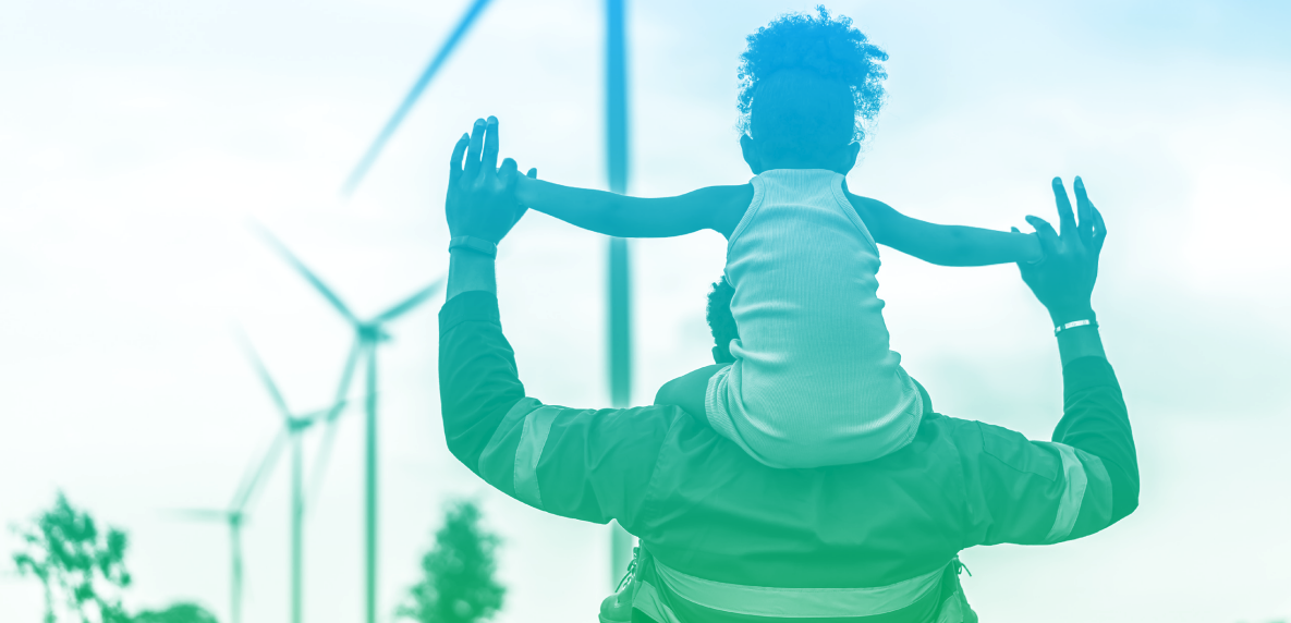 Gradient blue/green father with daughter on shoulders facing wind turbines