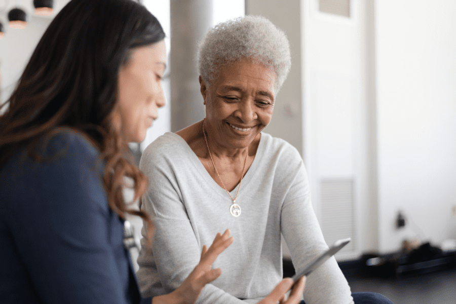 Woman having discussion with older woman