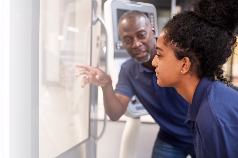 Woman working with man on project in uniform