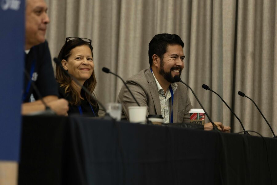 Speakers smiling at One Water Summit