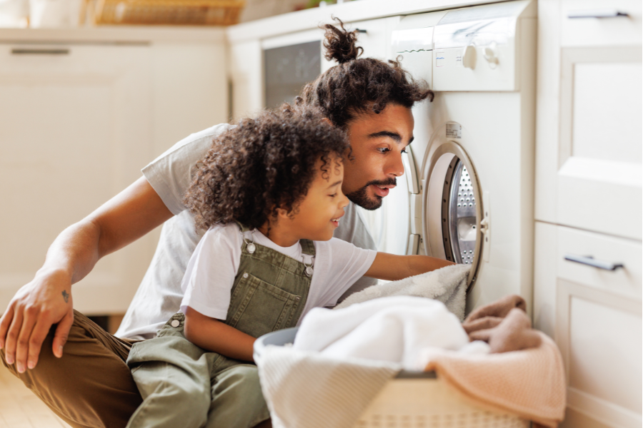 Dad and son doing laundry