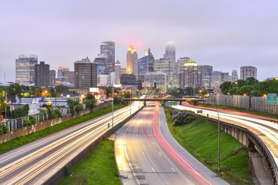 Foggy Minneapolis Skyline at Dusk with Traffic Light Trails