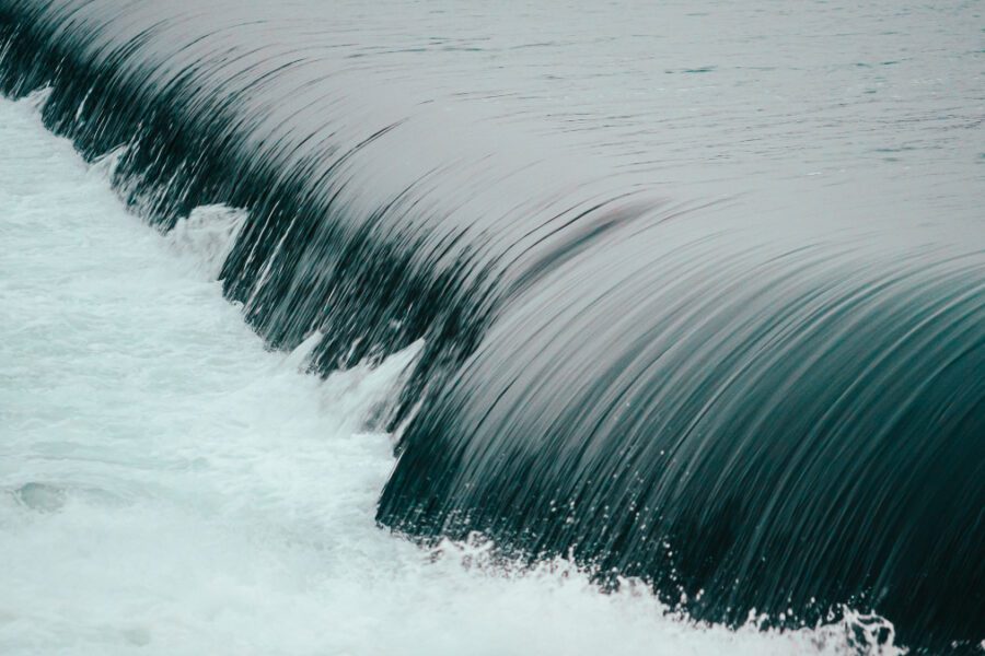 Water flowing into short waterfall